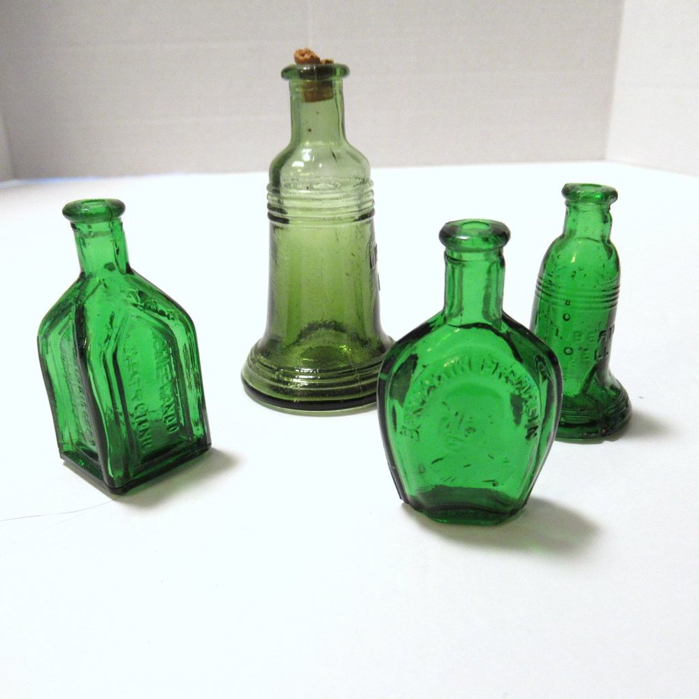 Vintage green mini bottles